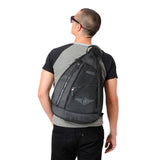 Guy wearing Black sling backpack